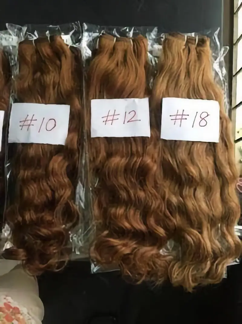 Three bundles of brown wavy hair in shades 10, 12 and 18